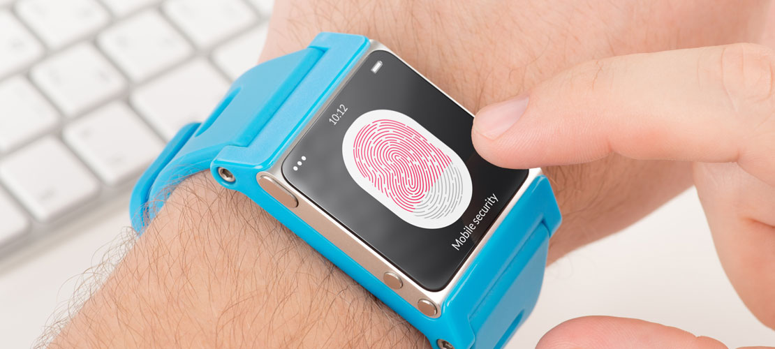 Close-up of a smartwatch processing a fingerprint scan.