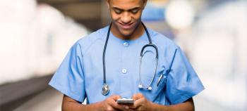 A doctor uses the miSecureMessages app on his mobile phone to send a smart page.